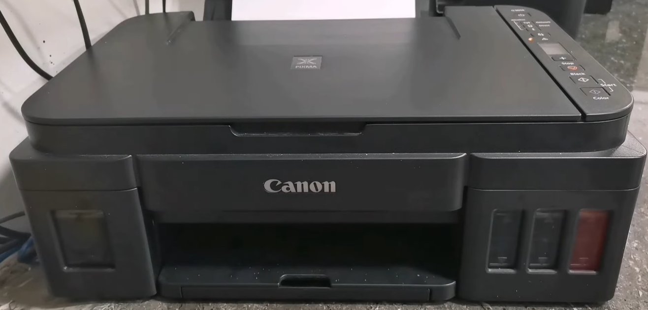 Canon Pixma G3000 front view showing the full printer body with control panel and ink tanks visible from outside — same waste ink absorber system as G2000 and G3010 models