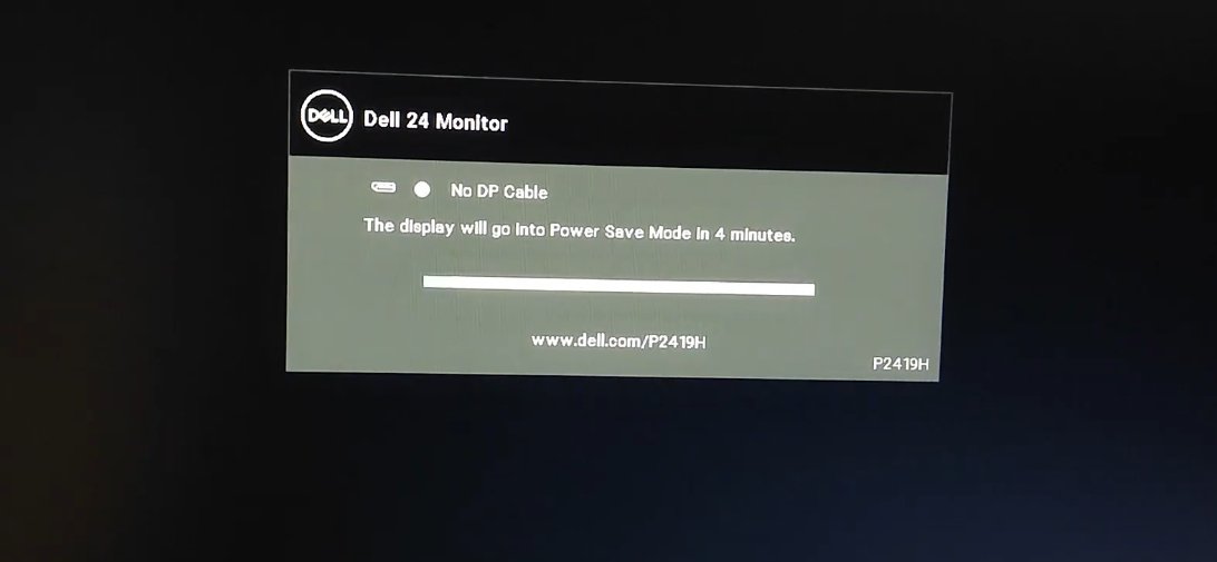 Dell P2419H 24-inch monitor displaying 'No DP Cable — The display will go into Power Save Mode in 4 minutes' message on black screen