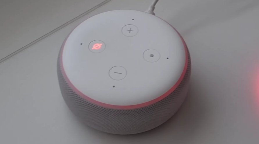 Top-down view of Amazon Echo Dot showing the red-lit mute microphone button indicating the microphone is currently disabled