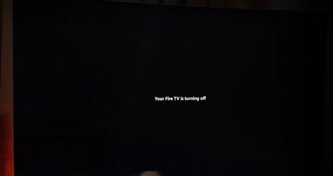 TV screen showing 'Your Fire TV is turning off' message on dark background — the shutdown confirmation during a remote-triggered restart or factory reset sequence