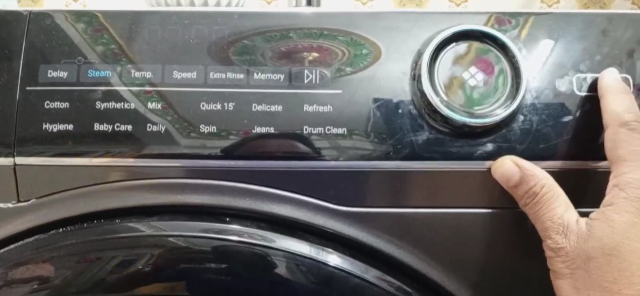 Washing machine control panel showing programme settings and cycle selector — front-load washing machine panel