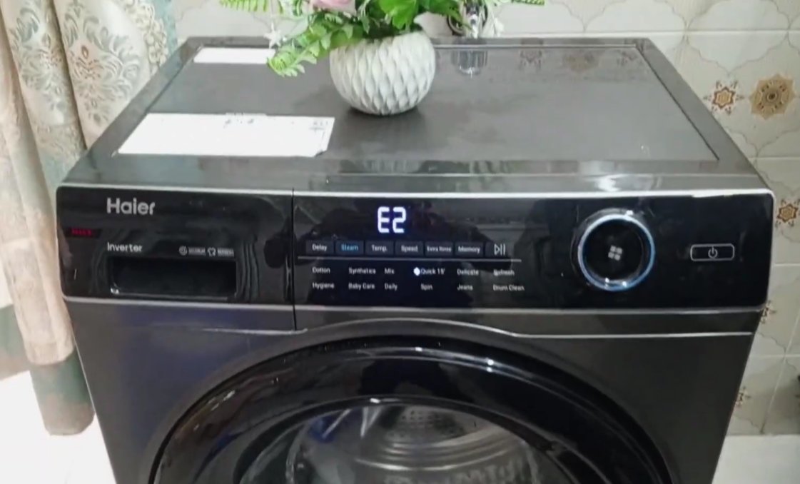 Front-load washing machine control panel showing error code display — washing machine error diagnosis