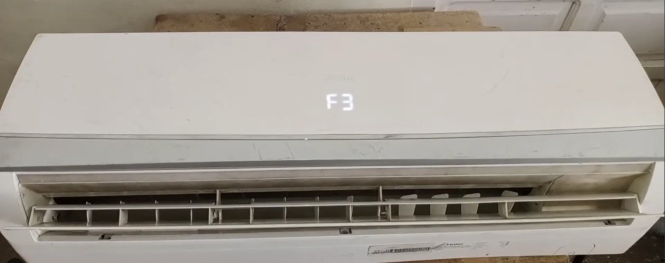 Haier split AC indoor unit with display clearly showing F3 error code — the unit is locked and will not cool until the sensor fault is resolved