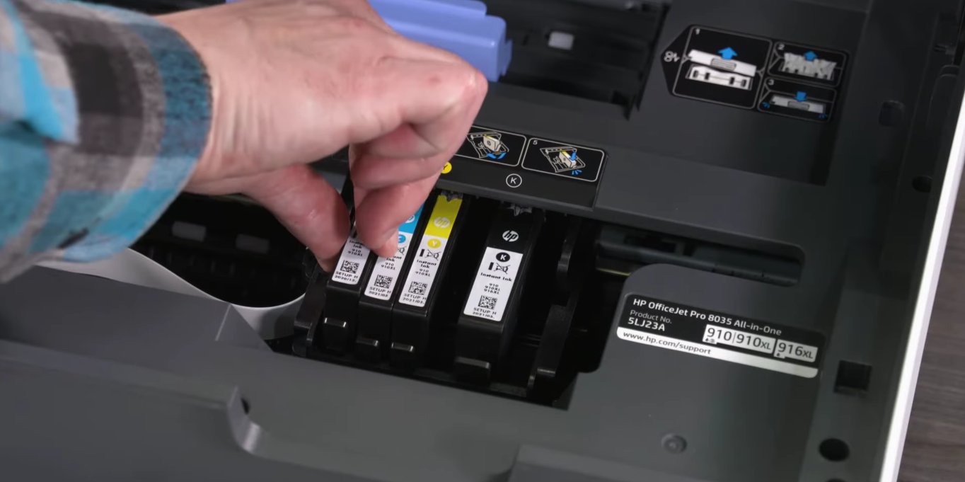 Hand reseating HP 910 ink cartridges into an HP OfficeJet Pro 8035 printer carriage