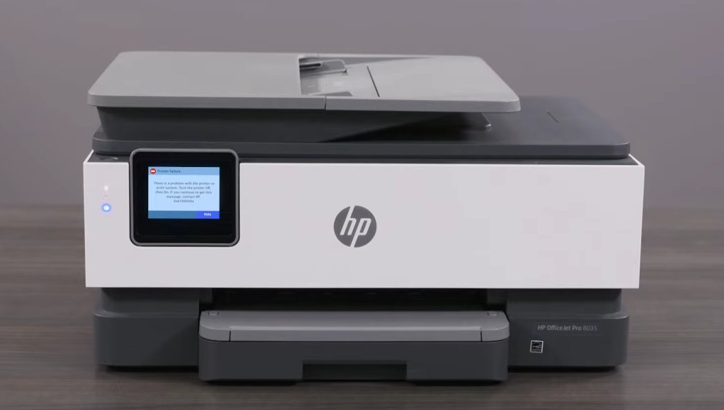 HP OfficeJet Pro 8035 printer showing Printer Failure 0x6100004a error message on its touchscreen display