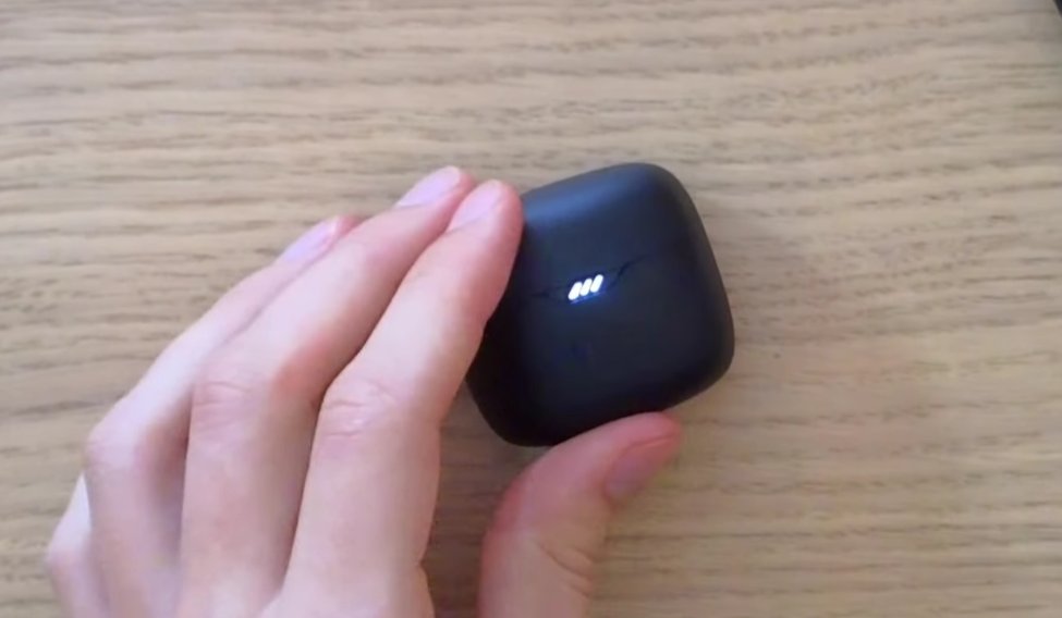JBL earbuds case showing charging light indicator — checking contacts and charging status
