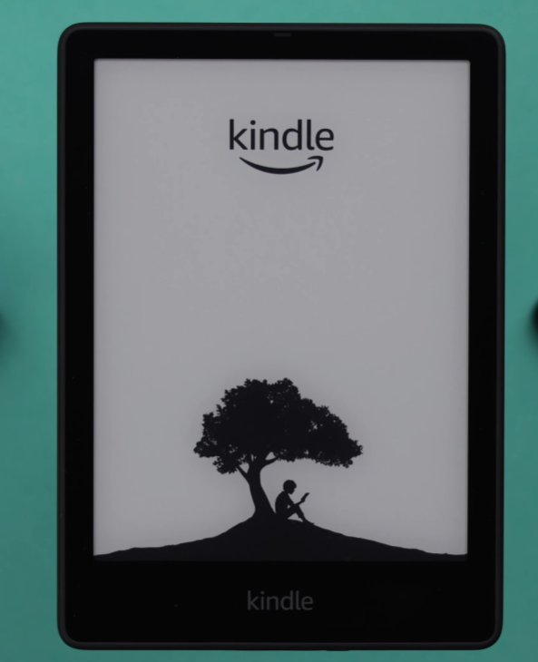 Kindle Paperwhite showing the classic tree screensaver with person sitting reading under a tree silhouette and Kindle logo at top on a teal background confirming the frozen screensaver state