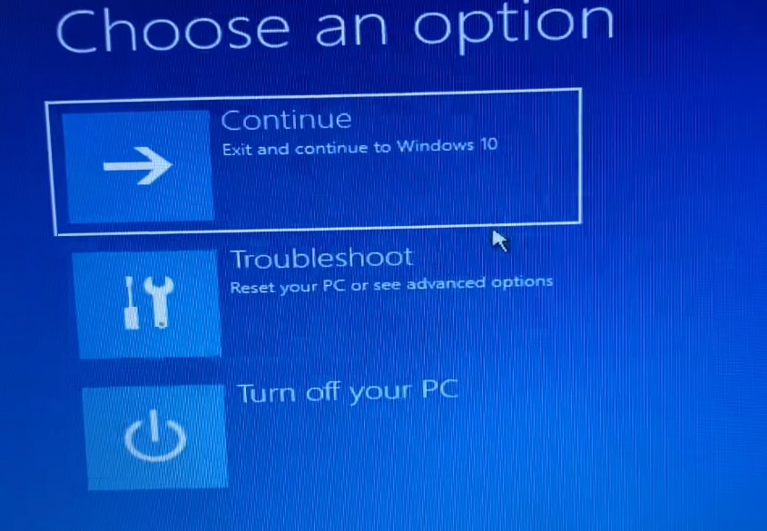 Windows blue 'Choose an option' recovery screen showing Continue, Troubleshoot and Turn off your PC tiles