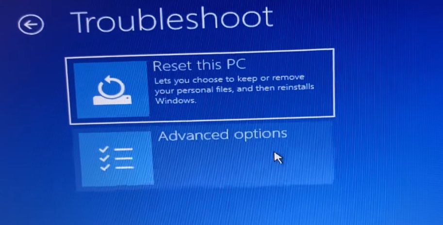 Windows Troubleshoot screen showing 'Reset this PC' and 'Advanced options' tiles on a blue background