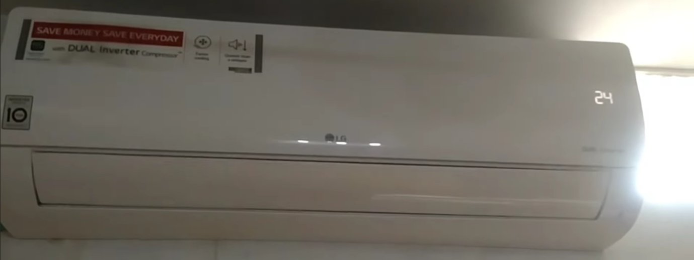 LG Dual Inverter AC indoor unit showing temperature display set to 24 degrees mounted on a white wall