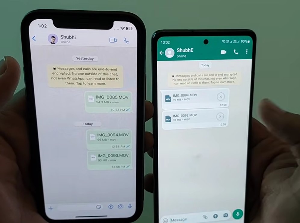 Two smartphones side by side showing the same WhatsApp conversation with contact Shubhi where the iPhone on the left shows the sender's view with sent video files IMG 0094 MOV and IMG 0093 MOV with delivery ticks while the Android on the right shows the receiving end still trying to download the same files as pending attachment icons