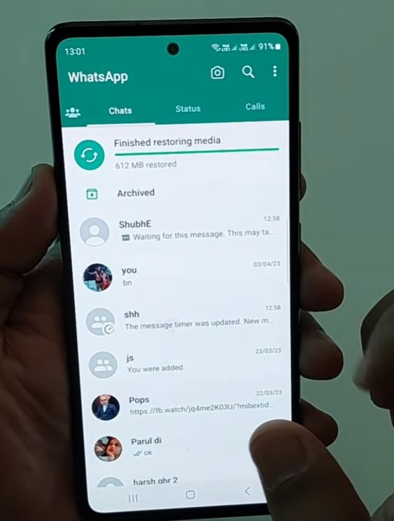 Android WhatsApp chat list showing the app in mid-restore state with Finished restoring media notification at the top showing 612 MB restored and the top conversation ShubhE showing the Waiting for this message preview text confirming the error appears during and after restore operations
